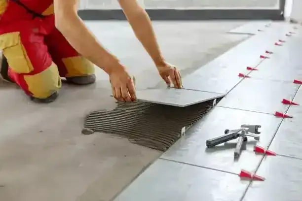 posa pavimenti con separatori piastrelle